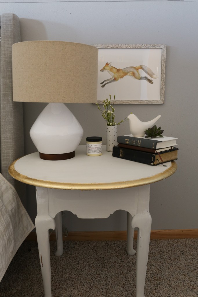 A sturdy end table is turned into a gray and gilded nightstand!  www.homestead128.com