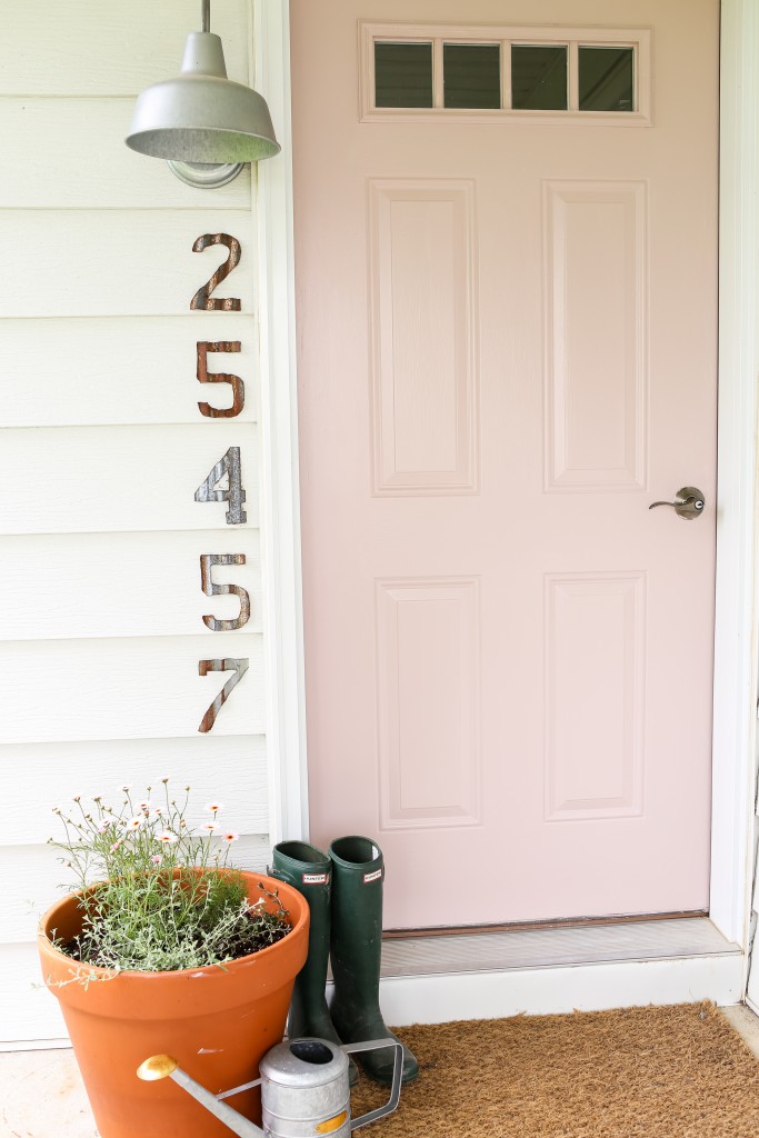 Pale pink front door. The Dempster Logbook.