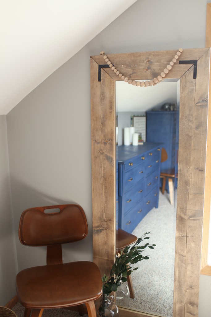 Create a large floor mirror with a modern farmhouse look from a basic door mirror.  An inexpensive DIY from The Dempster Logbook.