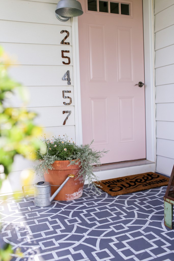 Welcoming pink front door for the farmhouse.