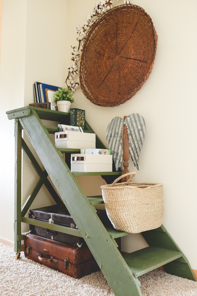 An old boat ladder is transformed into a hallway shelf with paint, and help from storage boxes and baskets.