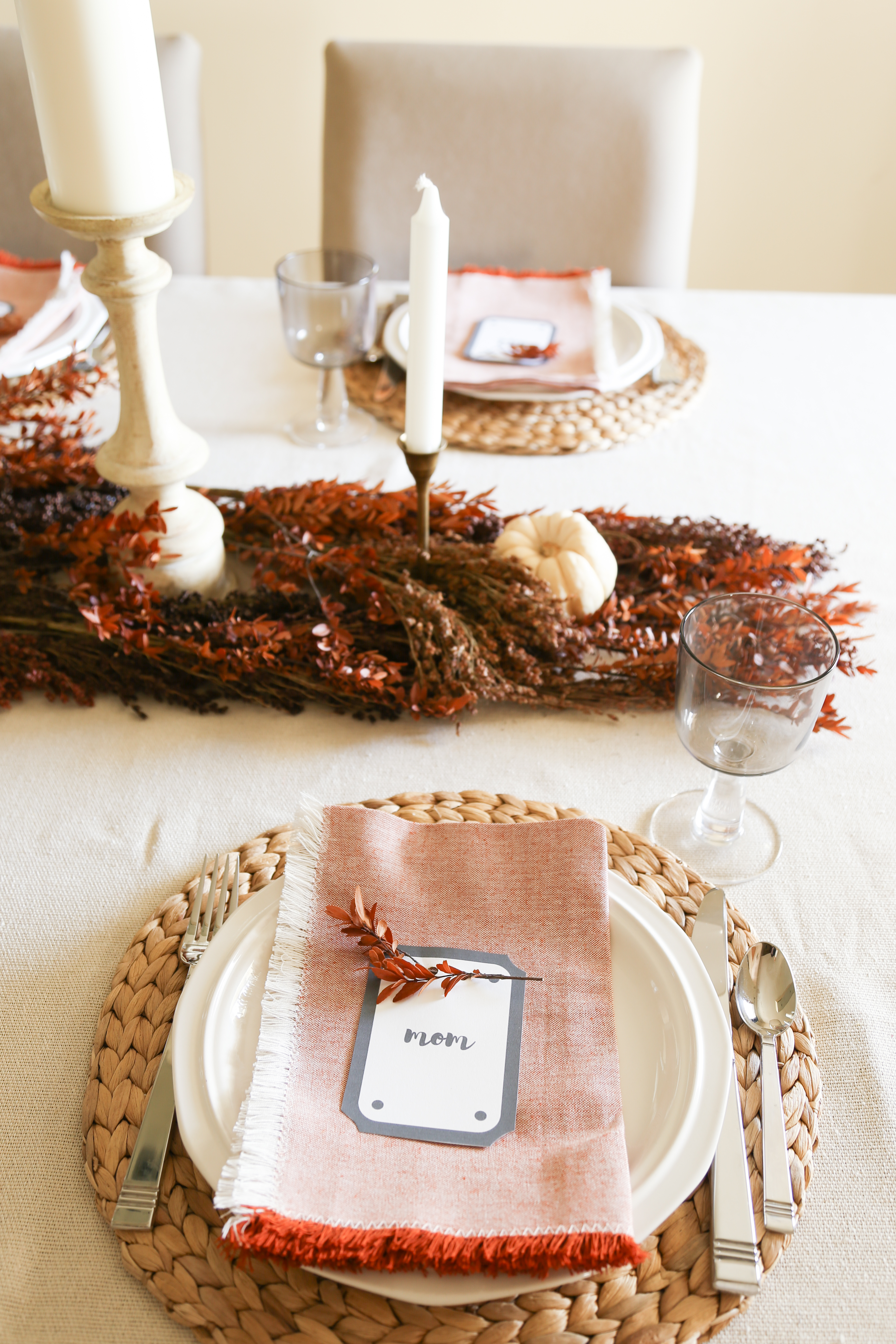 Decorate for thanksgiving using dried stems as a simple and elegant table runner.