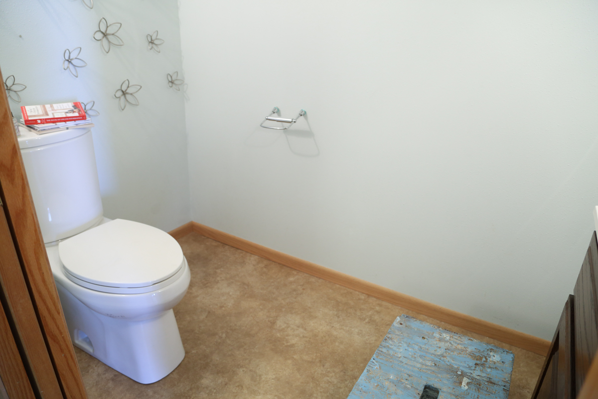 Before the half bathroom was updated to fit in with our modern farmhouse.