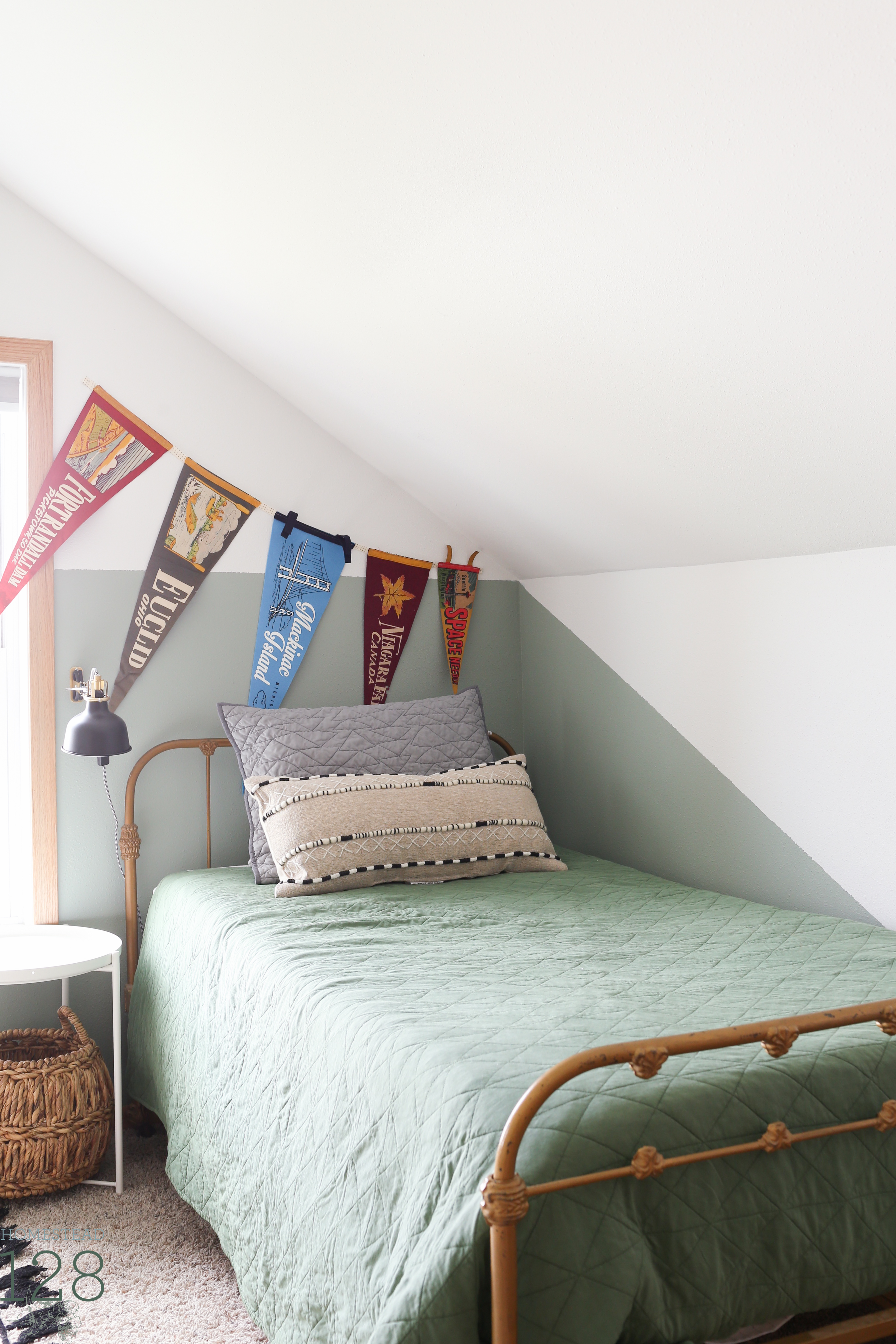 The vintage and playful boys bedroom is full of personal touches, white, black, green and gold.