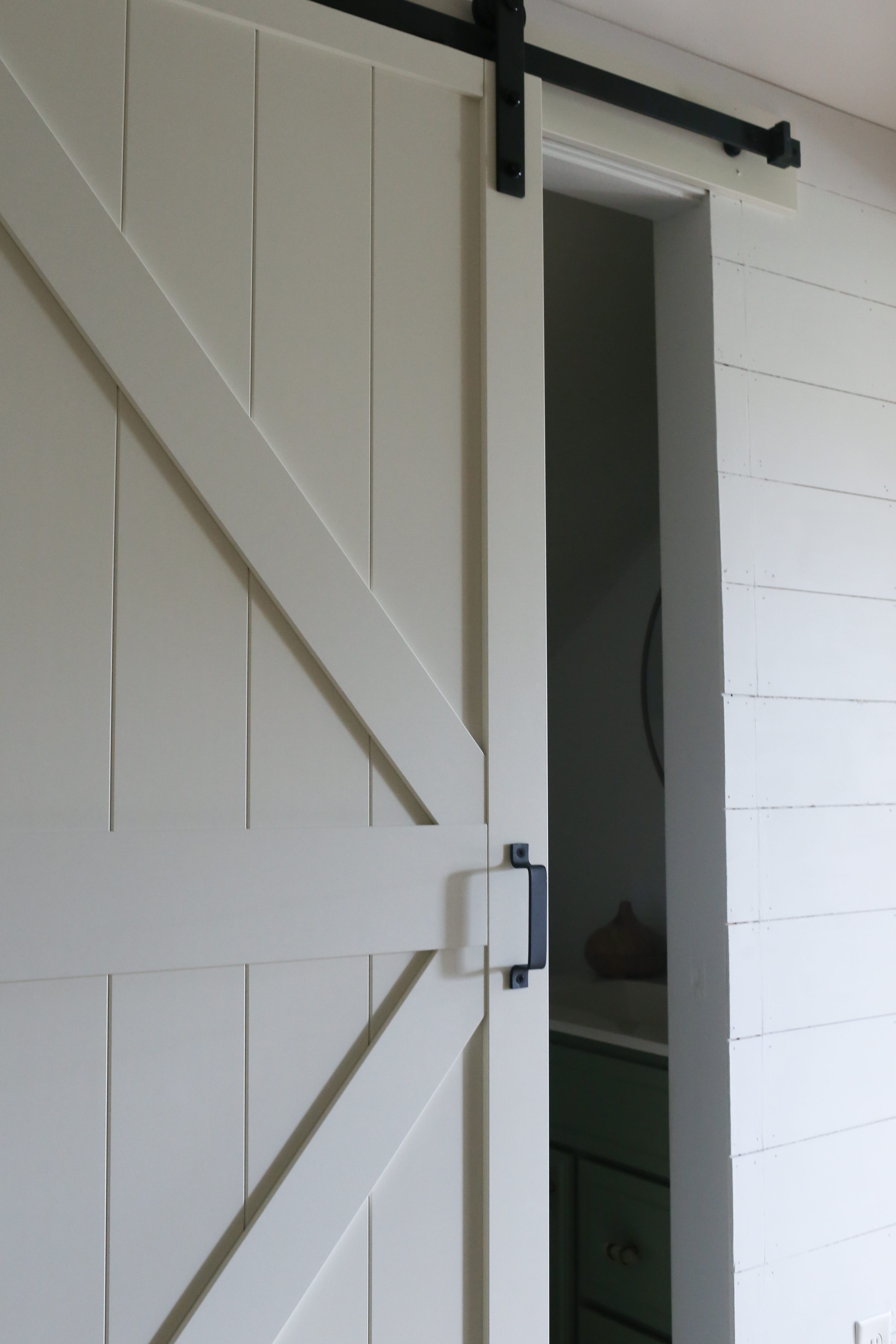 The builder basic hallway is updated to reflect the homes modern farmhouse style.
